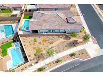 Stunning aerial view of the backyard featuring a private pool, spa, and desert landscaping at 314 Meadow Brush Pl, Henderson, NV 89011
