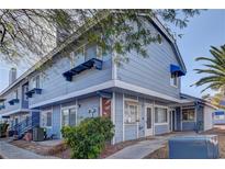Charming two-story condo with covered entry, patio, and well-maintained landscaping at 5345 Silvermist Ct # 203, Las Vegas, NV 89122