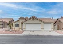 Charming single-story home with a two-car garage and well-maintained front yard at 5784 Dew Mist Ln, Las Vegas, NV 89110