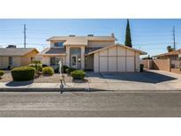 Charming two-story home features a well-maintained yard and inviting curb appeal at 637 Otono Dr, Boulder City, NV 89005