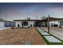 Charming single-story home featuring modern landscaping and a covered carport at 813 Bonita Ave, Las Vegas, NV 89104