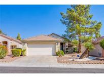 Charming single-story home with a well-manicured front yard and a two-car garage, perfect for suburban living at 2136 Eagle Sticks Dr, Henderson, NV 89012
