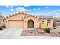 Charming single-story home featuring desert landscaping and cozy front porch swing at 2150 Grant Union Ct, Laughlin, NV 89029