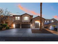 Charming two-story home featuring a three-car garage and inviting front entrance, perfect for a growing Gathering at 2743 Carolina Blue Ave, Henderson, NV 89052