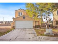 Two story home featuring desert landscaping, concrete driveway and an attached two car garage at 3626 Gold Sluice Ave, North Las Vegas, NV 89032