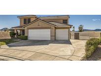 Spacious two-story home with a three-car garage and well-maintained landscaping at 525 Sunnys Halo Ct, Henderson, NV 89015