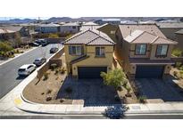 Charming two-story home with a well-maintained yard, paved driveway, and attached two car garage at 5269 Ardley Ave, Las Vegas, NV 89141