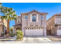 Inviting two-story home featuring desert landscaping and a spacious two-car garage at 6472 Chebec St, North Las Vegas, NV 89084