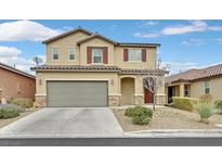 Charming two-story home featuring a neutral color palette, desert landscaping, and an attached two-car garage at 770 Drewsberry Ave, Las Vegas, NV 89178