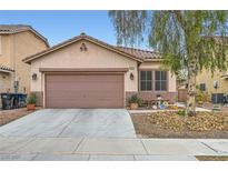 Charming single-story home with a well-maintained yard, mature tree, and inviting curb appeal at 8240 Corset Creek St, Las Vegas, NV 89131