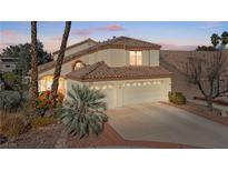 Charming home featuring a three-car garage and landscaped front yard at 8432 Squaw Valley Ave, Las Vegas, NV 89128