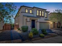 Charming two-story home with stone accents, a well-maintained yard, and a welcoming entrance at 8639 Tortoise Canyon Ct, Las Vegas, NV 89148