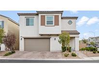 Charming two-story home with a neutral color palette and a two-car garage at 8677 Nichols Ave, Las Vegas, NV 89148