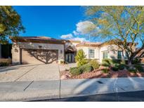 Charming single-story home featuring a well-manicured front yard, two-car garage, and secure gated entry at 10534 Mandarino Ave, Las Vegas, NV 89135