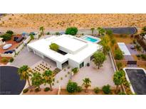 Stunning aerial view of a modern home with a pool and desert landscaping at 4135 N Durango Dr, Las Vegas, NV 89129