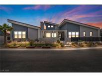 Stunning single-story home featuring modern design, xeriscaping, and a vibrant blue and gray color palette at 4345 N Dapple Gray Rd, Las Vegas, NV 89129