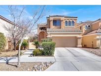 Charming two-story home with a well-manicured front yard and a two-car garage at 7156 N Campbell Rd, Las Vegas, NV 89149