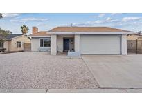 Charming single-story home featuring a two car garage and low maintenance desert landscaping at 7181 Pleasant View Ave, Las Vegas, NV 89147