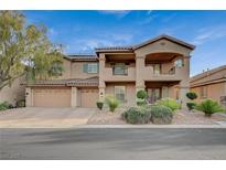 Inviting two-story home featuring a tile roof, spacious balcony, and well-maintained landscaping at 8093 Luna Sera Ave, Las Vegas, NV 89178