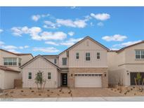 Inviting two-story home with neutral siding, stone accents, a two-car garage, and a well-maintained front yard at 8979 Rolling Pietra St, Las Vegas, NV 89166