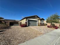 Charming single-story home with neutral stucco and brick accents, complemented by a manicured front yard at 2040 Port Royal Dr, Laughlin, NV 89029
