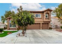 Charming two-story home with a well-manicured lawn, complemented by a three-car garage and inviting curb appeal at 4401 Lilac Glen Dr, Las Vegas, NV 89129