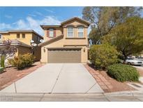 Charming two-story home featuring a well-manicured lawn and a two-car garage at 4650 Chino Peak Ct, Las Vegas, NV 89139