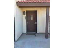 Inviting brown front door with secure screen door and a classic brown trim at 741 Bourbon St # E3, Pahrump, NV 89048