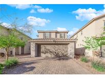 Charming two-story home featuring a two-car garage and low maintenance landscaping at 958 Harbor Ave, Henderson, NV 89002