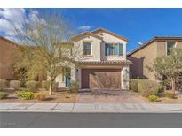 Charming two-story home showcasing a well-manicured front yard and inviting curb appeal in a suburban neighborhood at 120 Volans Ave, Las Vegas, NV 89183