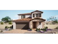 Charming two-story home with a two-car garage, tile roof, stone accents, and desert landscaping at 188 May Park Ave, Henderson, NV 89011