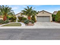 Charming single-story home featuring mature landscaping and a two-car garage at 2066 Cotton Valley St, Henderson, NV 89052