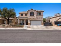 Charming two-story home featuring a well-manicured front yard and a spacious two-car garage at 2199 Maple Shade St, Henderson, NV 89002