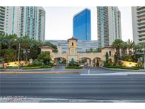 Elegant gated community entrance featuring beautiful landscaping and a clock tower at 2747 Paradise Rd # 1706, Las Vegas, NV 89109