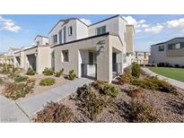 Charming two-story townhouse with drought-resistant landscaping and modern architectural details at 3541 Arcadian Sea St, Las Vegas, NV 89106