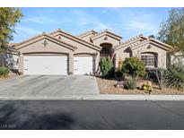 Charming single-story home featuring a three-car garage and desert landscaping in a serene neighborhood at 10638 La Spezia Way, Las Vegas, NV 89141