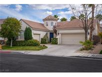 Charming single-story home featuring a turret entrance, well-manicured lawn, and a two-car garage at 2287 Moresca Ave, Henderson, NV 89052