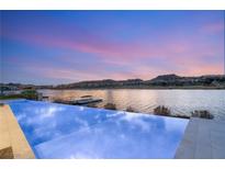 Beautiful infinity pool overlooking the lake with stunning sunset views at 32 Grand Corniche Dr, Henderson, NV 89011