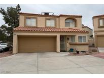 Charming two-story home featuring a two-car garage, desert landscaping, and a welcoming front entrance with a decorative wreath at 3331 Cheltenham St, Las Vegas, NV 89129