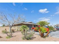 Charming single-story home featuring desert landscaping and a spacious driveway at 4305 Puebla St, Las Vegas, NV 89115