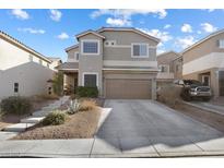 Two-story home featuring desert landscaping, a two-car garage, and a concrete driveway at 5131 Moose Falls Dr, Las Vegas, NV 89141