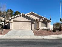 Charming single-story home with a two-car garage and low maintenance landscaping, ready for a new Gathering at 220 Sandpiper Village Way, Henderson, NV 89012