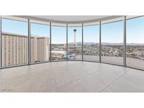 Bright living room with floor-to-ceiling windows offering panoramic city views at 222 Karen Ave # 1908, Las Vegas, NV 89109