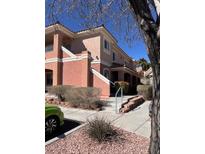 Attractive condo complex with multiple levels and desert landscaping in a gated community at 301 Pine Haven St # 202, Las Vegas, NV 89144