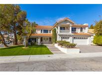 Charming two-story home featuring a red tile roof, manicured lawn, and inviting curb appeal at 3021 Ocean Port Dr, Las Vegas, NV 89117