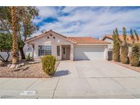 Charming single-story home featuring a terracotta tile roof and a well-manicured front yard at 3125 Cristobal Way, Las Vegas, NV 89117
