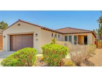 Charming single-story home featuring a well-maintained front yard and an attached two-car garage at 3649 Starlight Ranch Ave, North Las Vegas, NV 89081