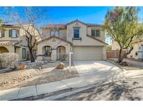 Charming two-story home with well-kept front yard landscaping and a two car garage at 4225 Ponce Royal Ave, North Las Vegas, NV 89031