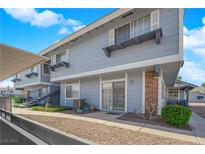 Charming two-story home with landscaped front, complemented by a brick accent and cozy patio at 5335 Duralite St # 203, Las Vegas, NV 89122