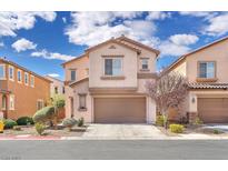 Inviting two-story home featuring a well-manicured front yard and an attached two-car garage at 5351 Glenburnie St, Las Vegas, NV 89122